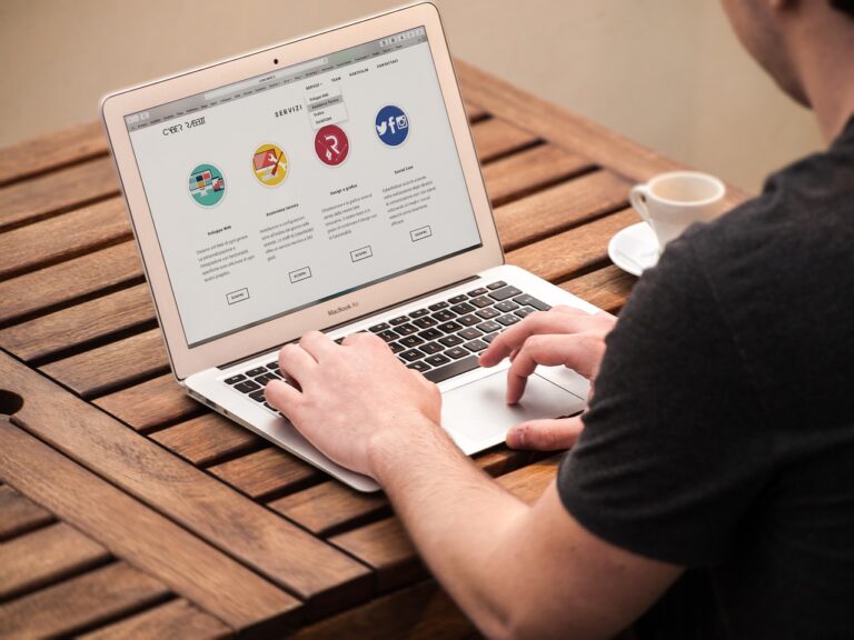 A person, looking at their computer searching for a press release, blog or news